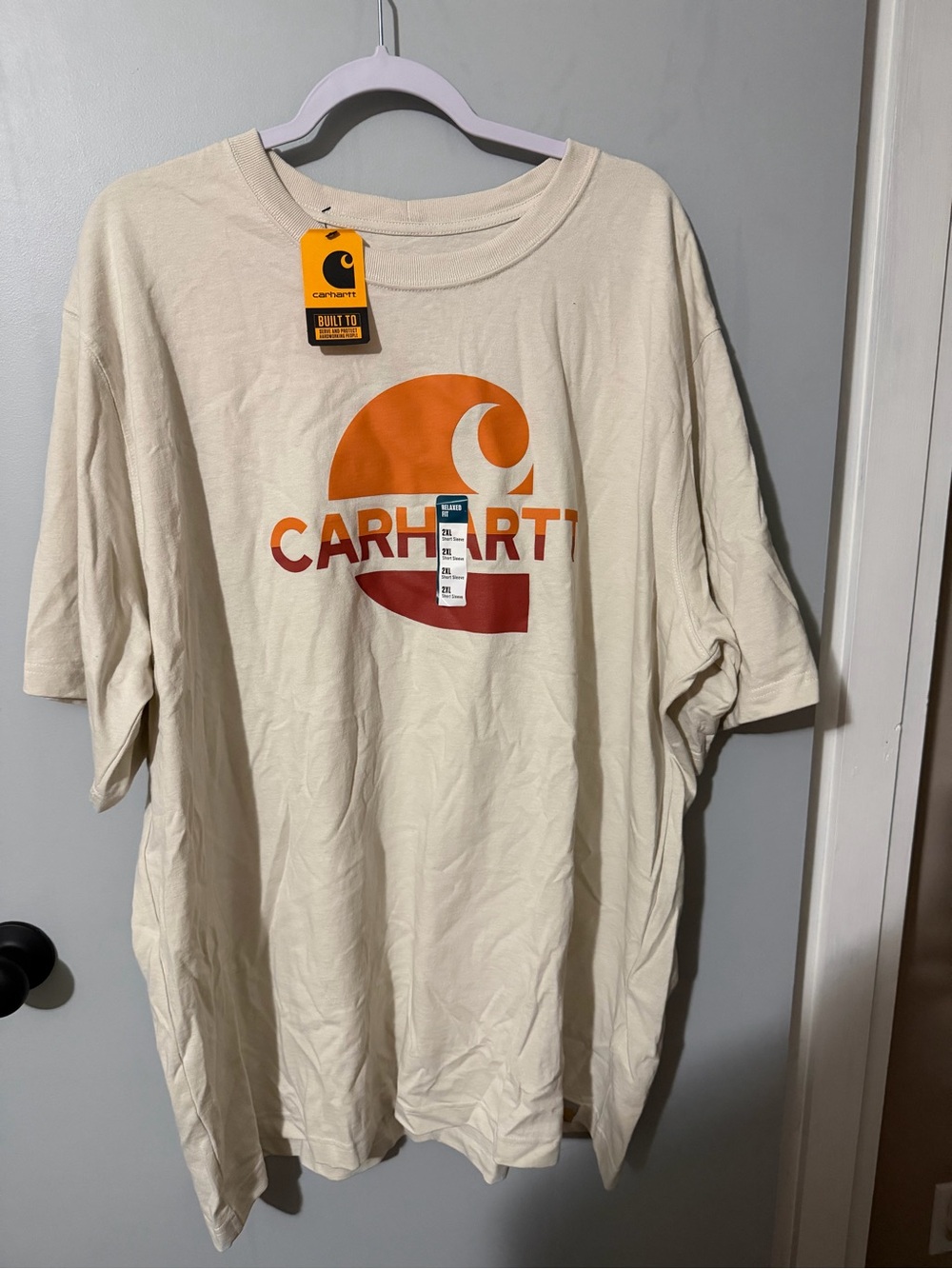 Carhartt Cream Tee with Black and Orange Logo Tag